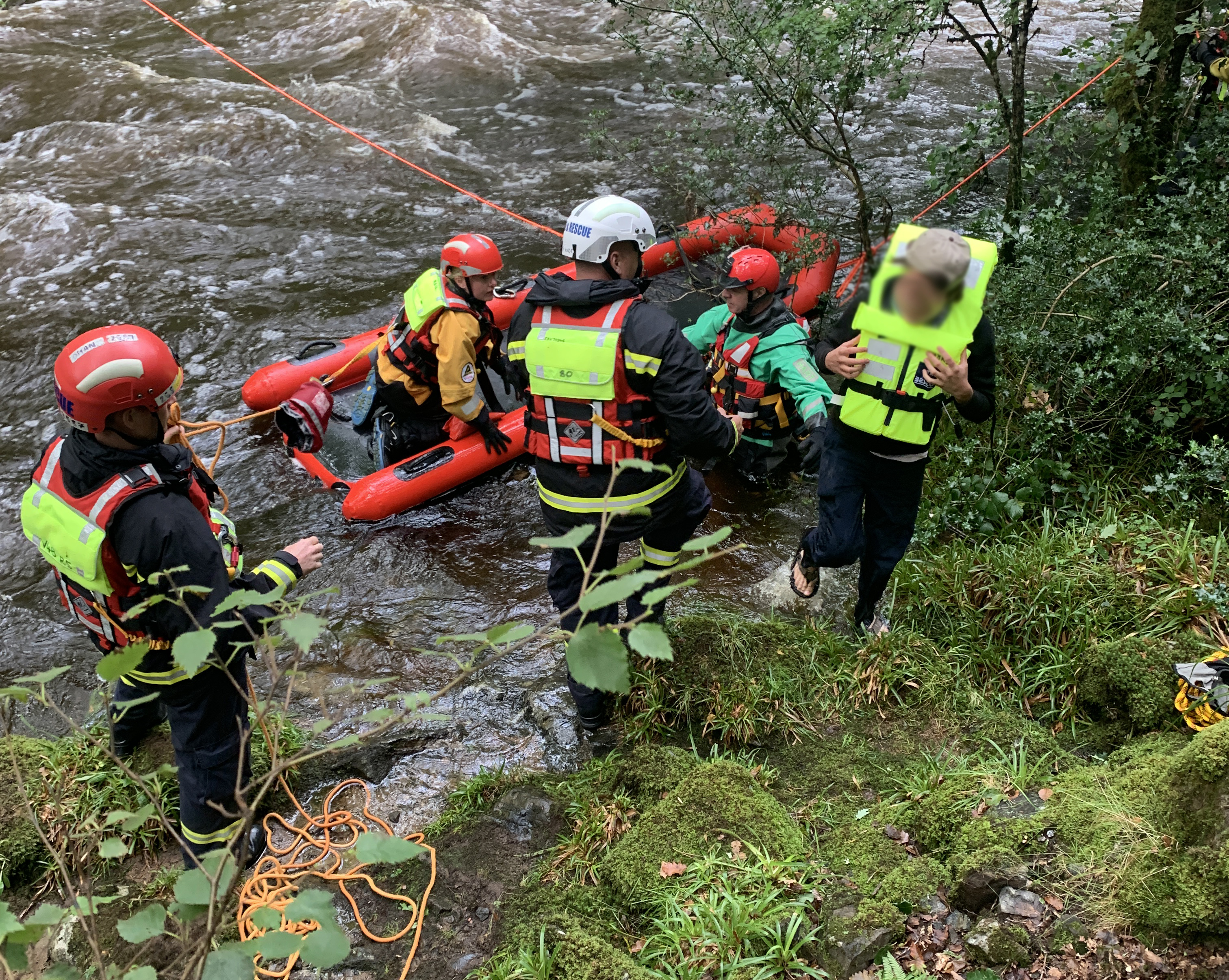 People being rescued from the River Dart
