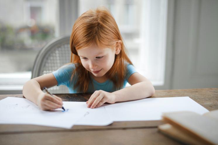 A little girl writing