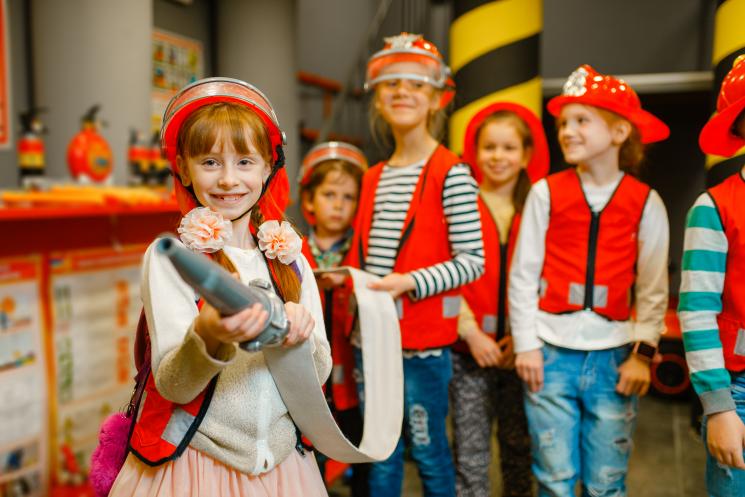 Children dressed in firefighter costumes