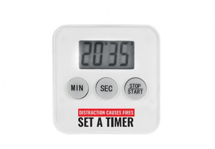 Digital cooking timer branded with the words 'distraction causes fires - set a timer'