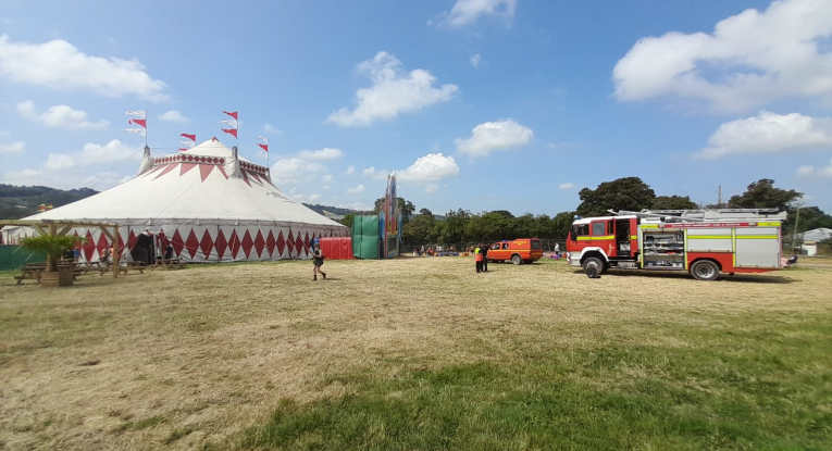 A fire engine near a circus tent at Glastonbury Festival